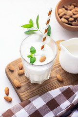Healthy breakfast. Almond milkshake in a glass glass. Alternative milk drink.