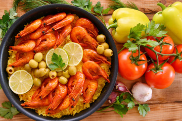 Rice paella with shrimp, saffron and olive oil