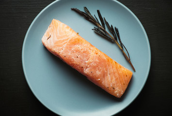 Raw salmon fillet on a plate, organic food.