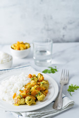 Curry chicken with rice in a plate