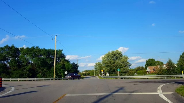 Driving Approaching Rural Stop Sign, Stopping, and Turning Left. Driver Point of View POV Driver Approach Road Sign and Turns.