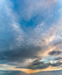 Fantastic clouds at sunrise, vertical panorama