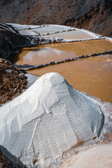 Big pile of harvested salt at the Maras salt mines, Peru, South America