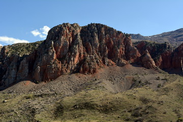 Naklejka premium Red rock near the Noravank monastery in Armenia .