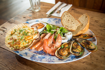Fresh seafood platter prawns mussels chowder sharing meal