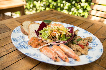 Prawn fish seafood sharing platter al fresco eating pub food outside