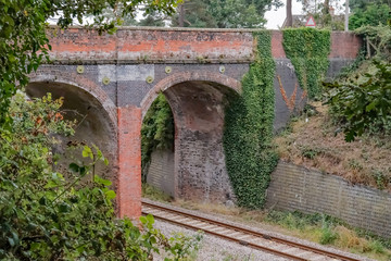 Fototapeta na wymiar Brick built bridge over the railway line in rural Norfolk