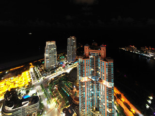 Aerial drone photo Miami Beach highrise towers at night