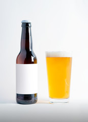 Beer Bottle Mock-Up with glass of session pale ale and foam. Blank Label