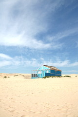 Typical tiny wooden colorful house, in Costa da Caparica, Lisbon, Portugal.