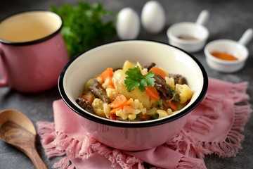 Turkey stew heart with potatoes, cauliflower, onions and carrots.