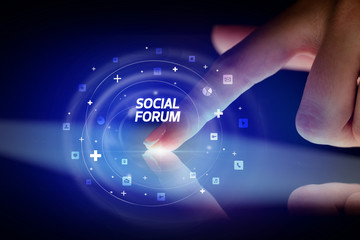 Finger touching tablet with social media icons and SOCIAL FORUM