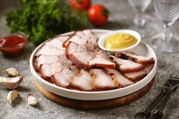 Baked pork belly with seasonings and spices. Homemade food.