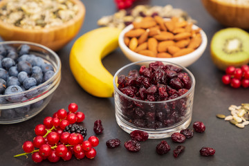 Group Fruits Breakfast with bread Whole grains and nuts, yogurt mix with Cherry , banana, avocado in the wooden table. Breakfast for Health and Diet concept