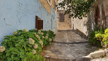 Fototapeta na wymiar old stone house. Path. Stone steps. Narrow street.