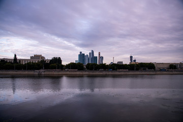 Naklejka premium panoramic view of the big river in the city at sunrise