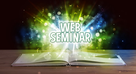 WEB SEMINAR inscription coming out from an open book, educational concept