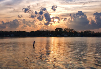 Obraz na płótnie Canvas Sunset in Colonial Beach Virginia with a Buoy in the Background