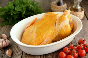 Raw fresh organic chicken marinated in turmeric with olive oil and white wine vinegar. Healthly food.