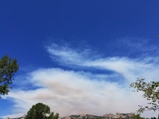 Smoke clouds from forest fires over Rocky Mountains