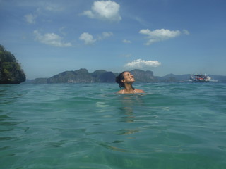 Tan Woman Relaxing In The Water