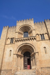 Principal facade of Se Velha, Santa Maria de Coimbra, the old Cathedral of Coimbra, Portugal.
