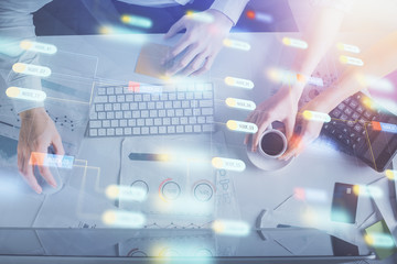 Double exposure of man and woman working together and data theme hologram drawing. Computer background. Top View.