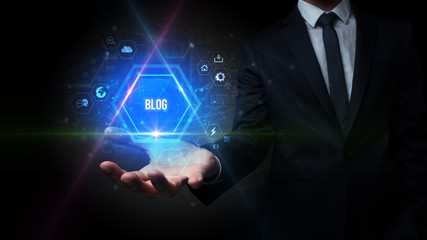 Man hand holding BLOG inscription, social media concept