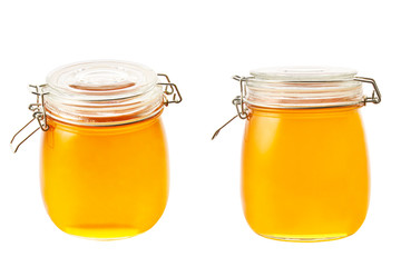 big jar of honey isolated on white background.