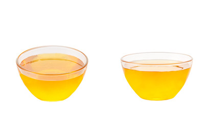 plate of natural honey isolated on white background.