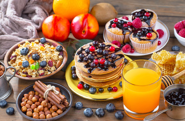 Breakfast natural healthy food, dessert, drinks, fruits, on an old background with kitchen accessories.
