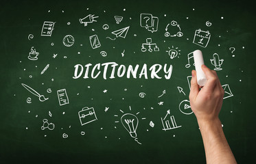 Hand drawing DICTIONARY inscription with white chalk on blackboard, education concept