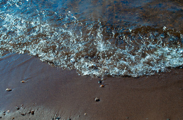 Sandy shore. River surf.