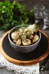 Homemade lightly salted mushrooms with dill and garlic. Healthly food.