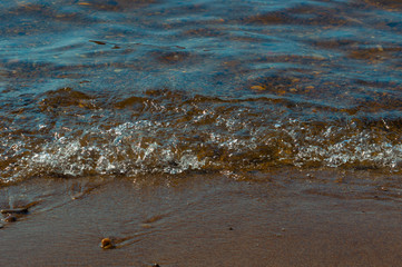 Sandy shore. River surf.