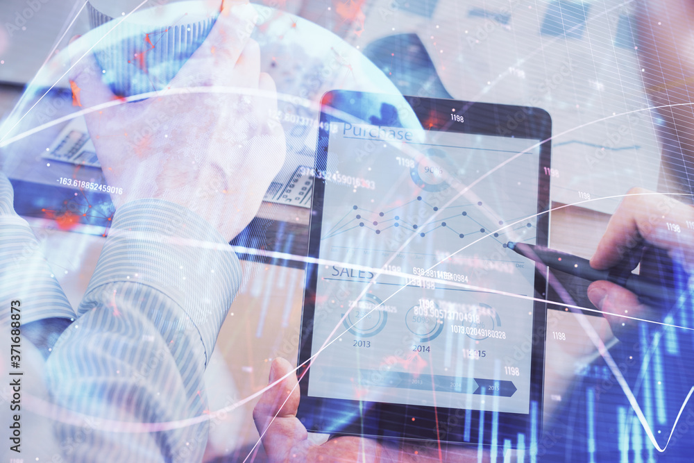 Poster double exposure of man's hands holding and using a phone and financial chart drawing. market analysi