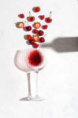 Concept composition presenting red wine flavours of summer fruits of berries