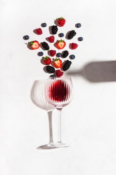 Concept composition presenting red wine flavours of summer fruits of berries