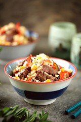 Fried rice with beef meat, corn, eggplant, carrots, garlic, bell pepper and garlic.