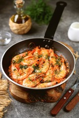 Fried shrimps in tomato sauce with garlic, dill and lemon juice. Healthly food.