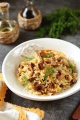 Fried rice with chanterelles 
 mushrooms, onions, carrots and celery.