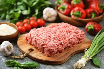 Minced meat, organic bell peppers, rice and spices for making stuffed peppers.