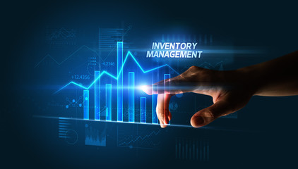 Hand touching INVENTORY MANAGEMENT button, business concept