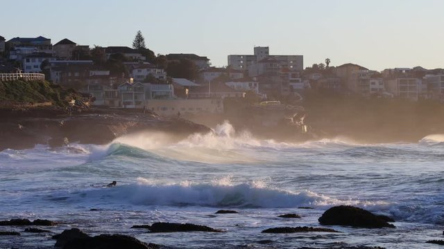 Waterfront of Bronte beach eastern suburbs at sunrise – surfers, fishing as 4k.
