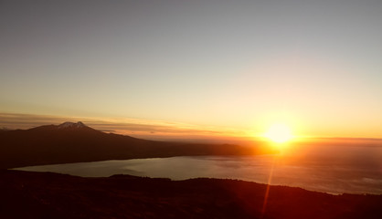 Fototapeta na wymiar Sunset over Calbuco Volcano seen from Osorno Volcano