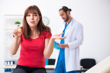 Female diabetic patient visiting young male doctor