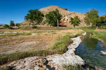 Obraz premium Hot springs mineral water flows through Hot Springs State Park in Thermopolis, Wyoming
