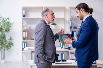 Boss and his assistant discussing company results