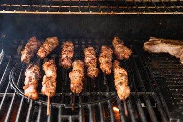 Grilled Pork Meat Kebab Skewers on a Professional Barbeque