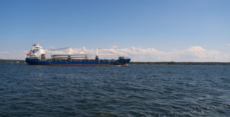 A large carrier boat on a river © Joe